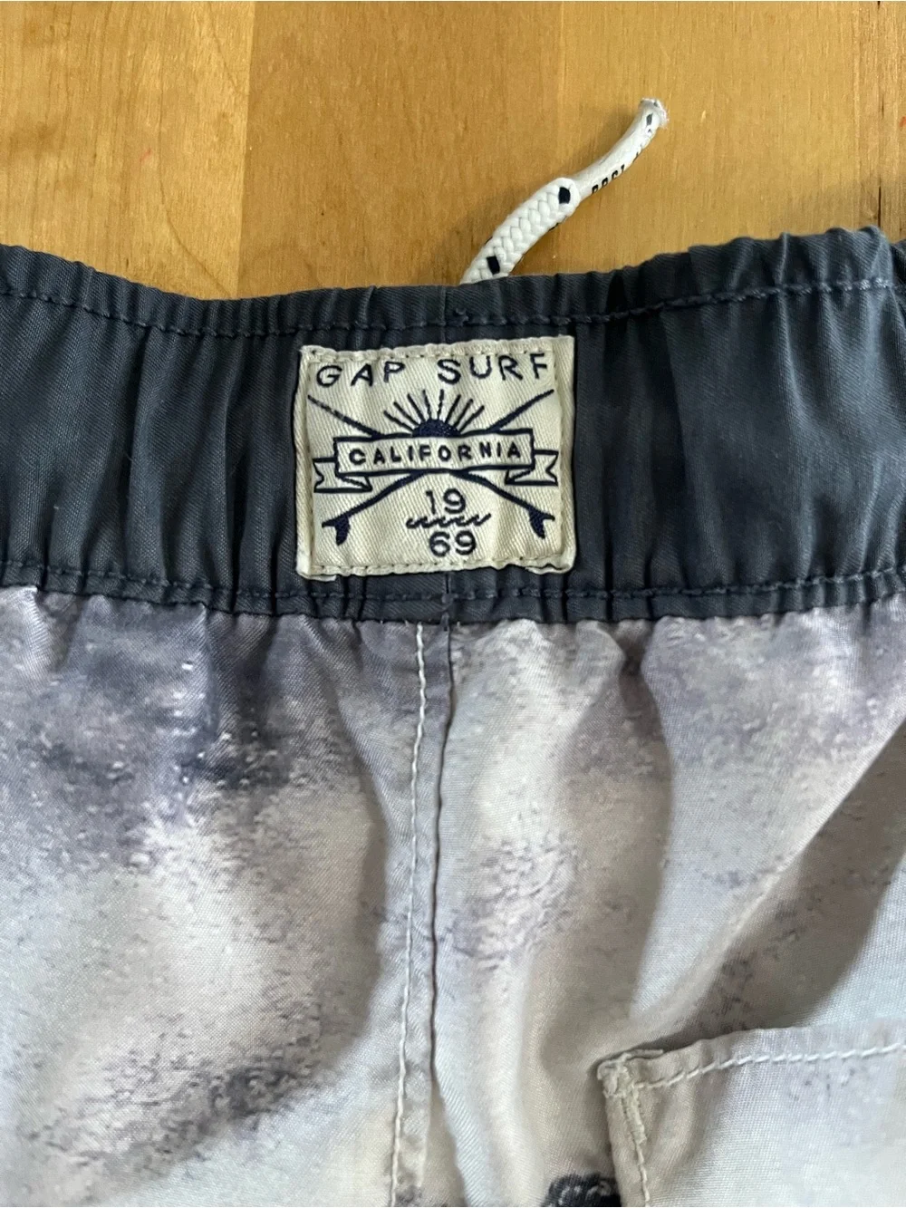 GAP Boys Black and White Shark Wave Swim Shorts with Red Accent